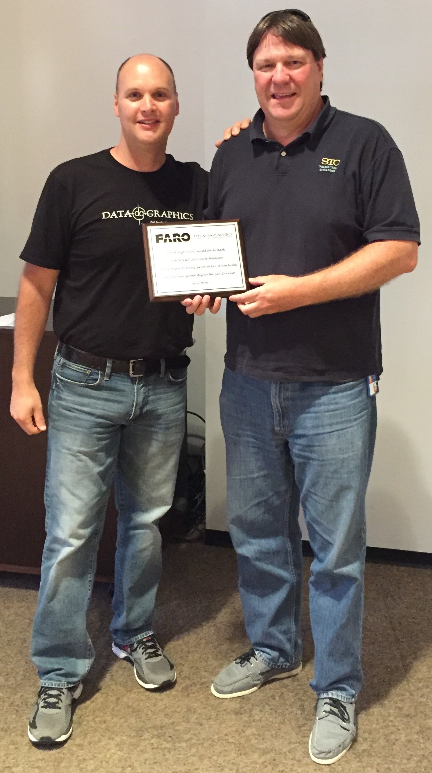 CEO Brad Presenting a plaque honoring our host with the most, Tom. Thanks again for everything, Tom and the Faro Team.